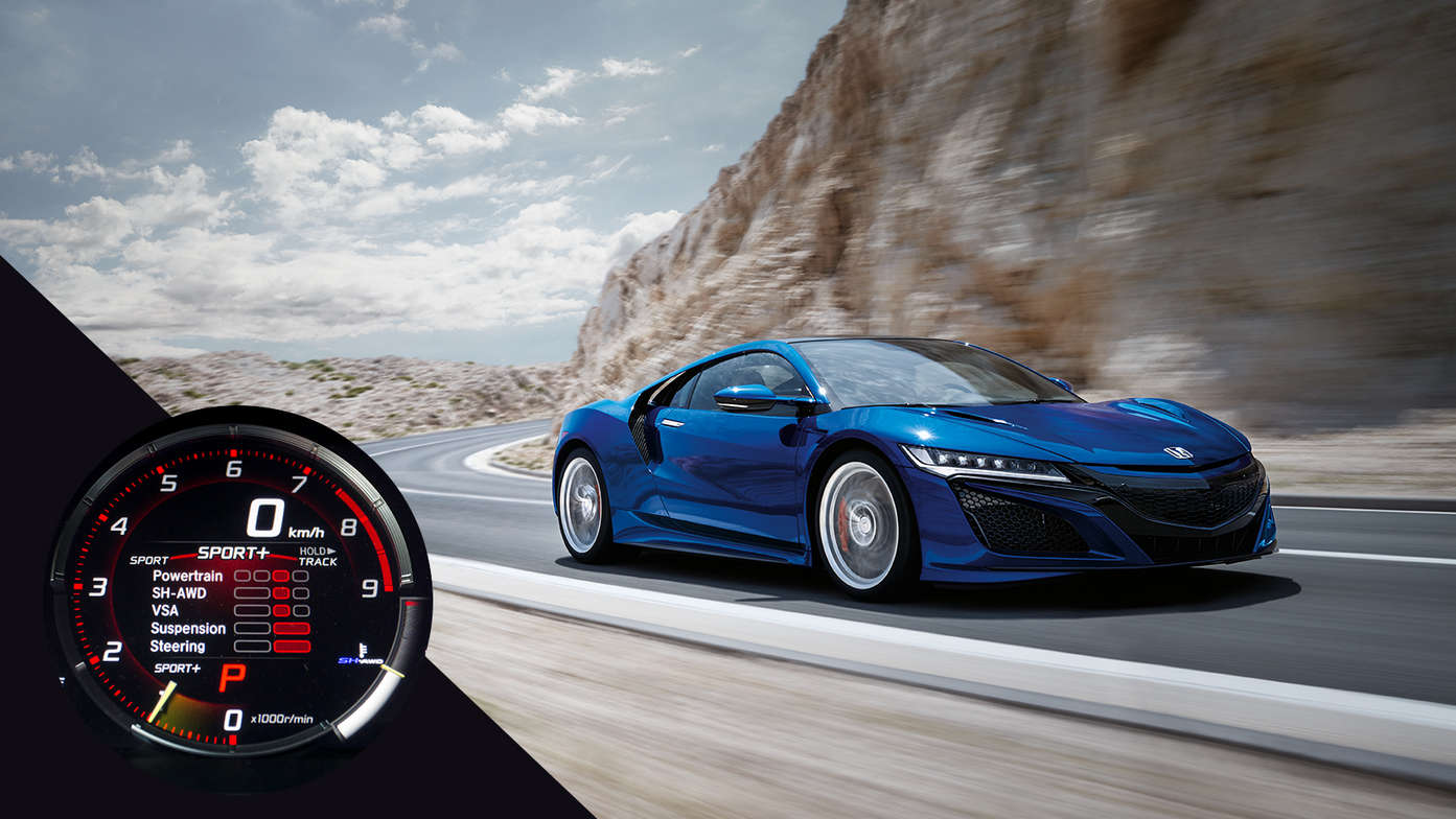 Vue de trois quarts avant de la Honda NSX sur une route de montagne exposée au vent.